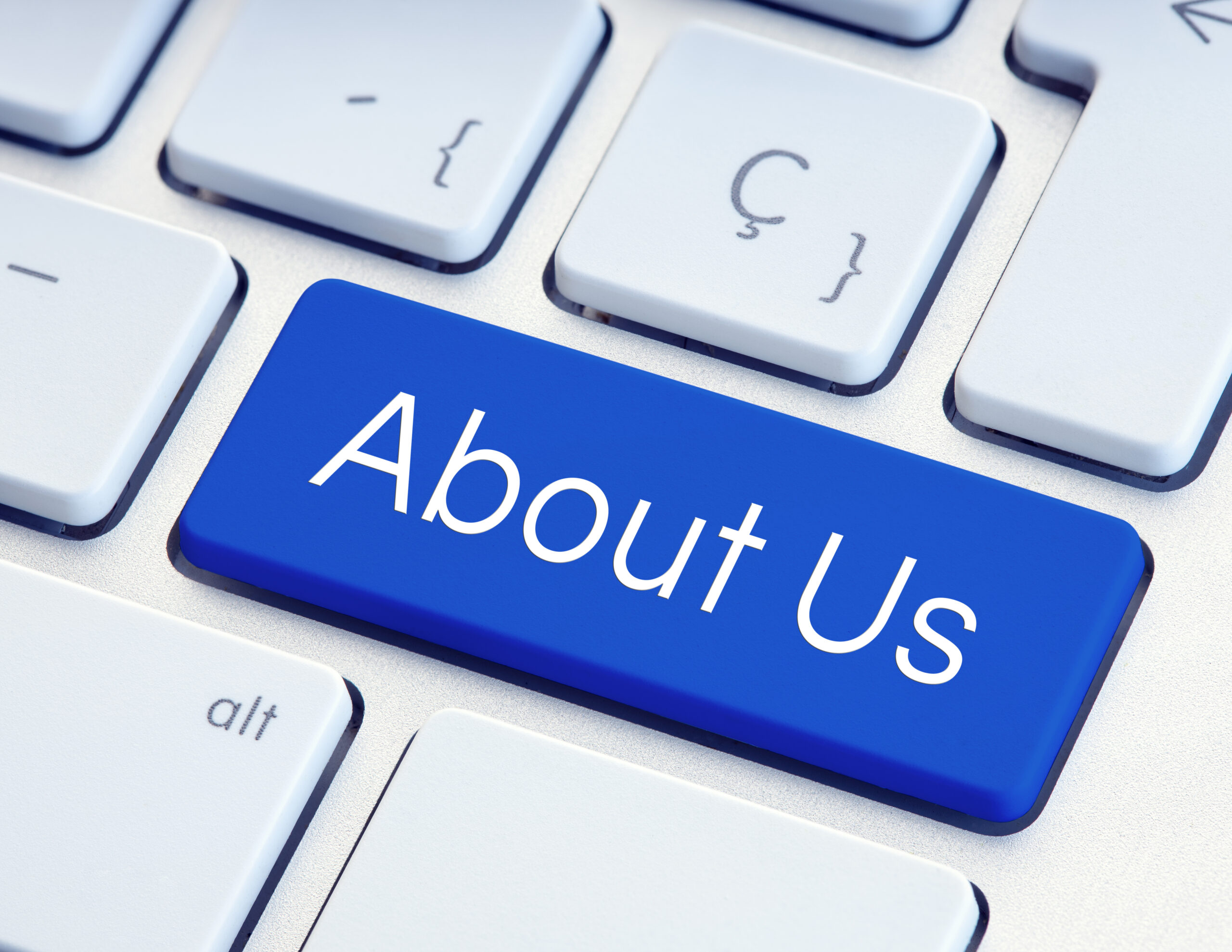 About Us Word on blue computer Keyboard Key